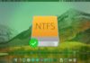 Device NTFS al centro dell'immagine, con sullo sfondo macOS High Sierra